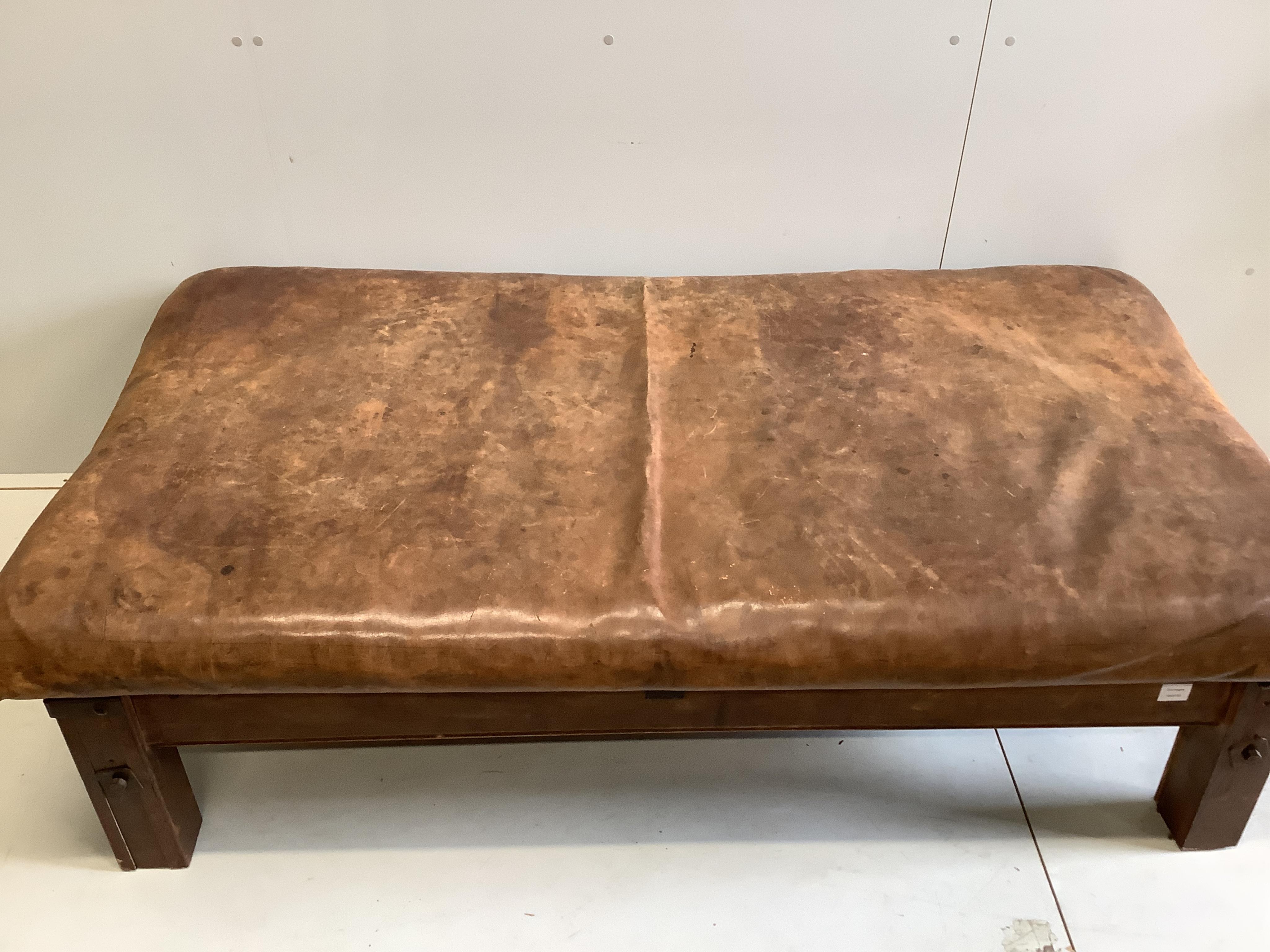 A Contemporary rectangular brown leather stool, width 178cm, depth 90cm, height 50cm. Condition - fair